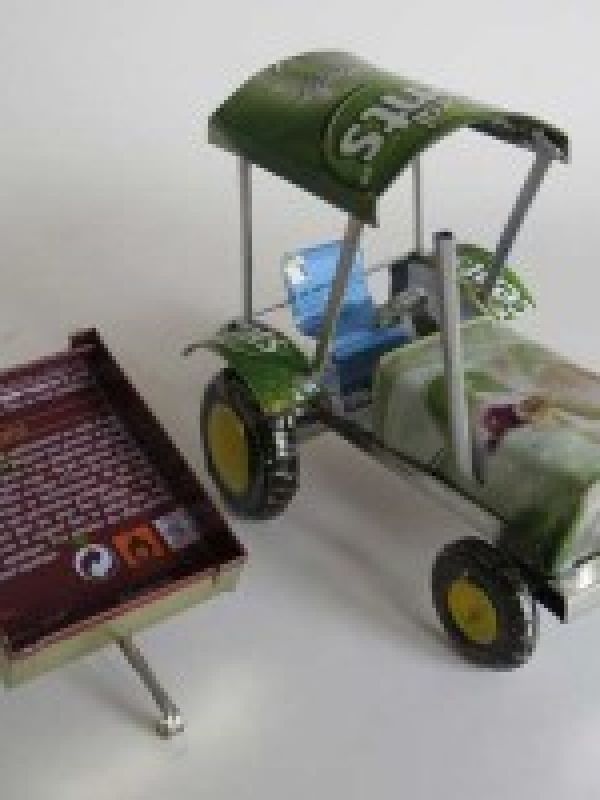 18. Tractor with cart. Both handmade of collected metal waste (used cans) . Click below to find it in La Maison Afrique FAIR TRADE assortment. 